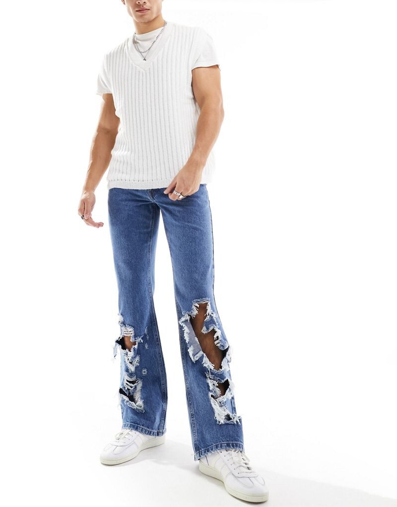 

Синие винтажные расклешенные джинсы с крупными рвами ASOS DESIGN