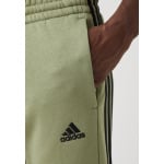 Спортивные брюки ESSENTIALS TAPERED CUFF 3 STRIPES PANTS adidas Sportswear, зеленый - фото