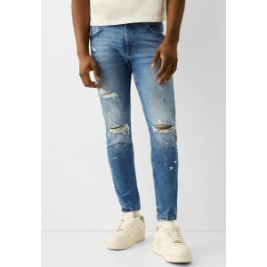 Джинсы узкого кроя Ripped Paint Splatter Bershka, цвет blue denim