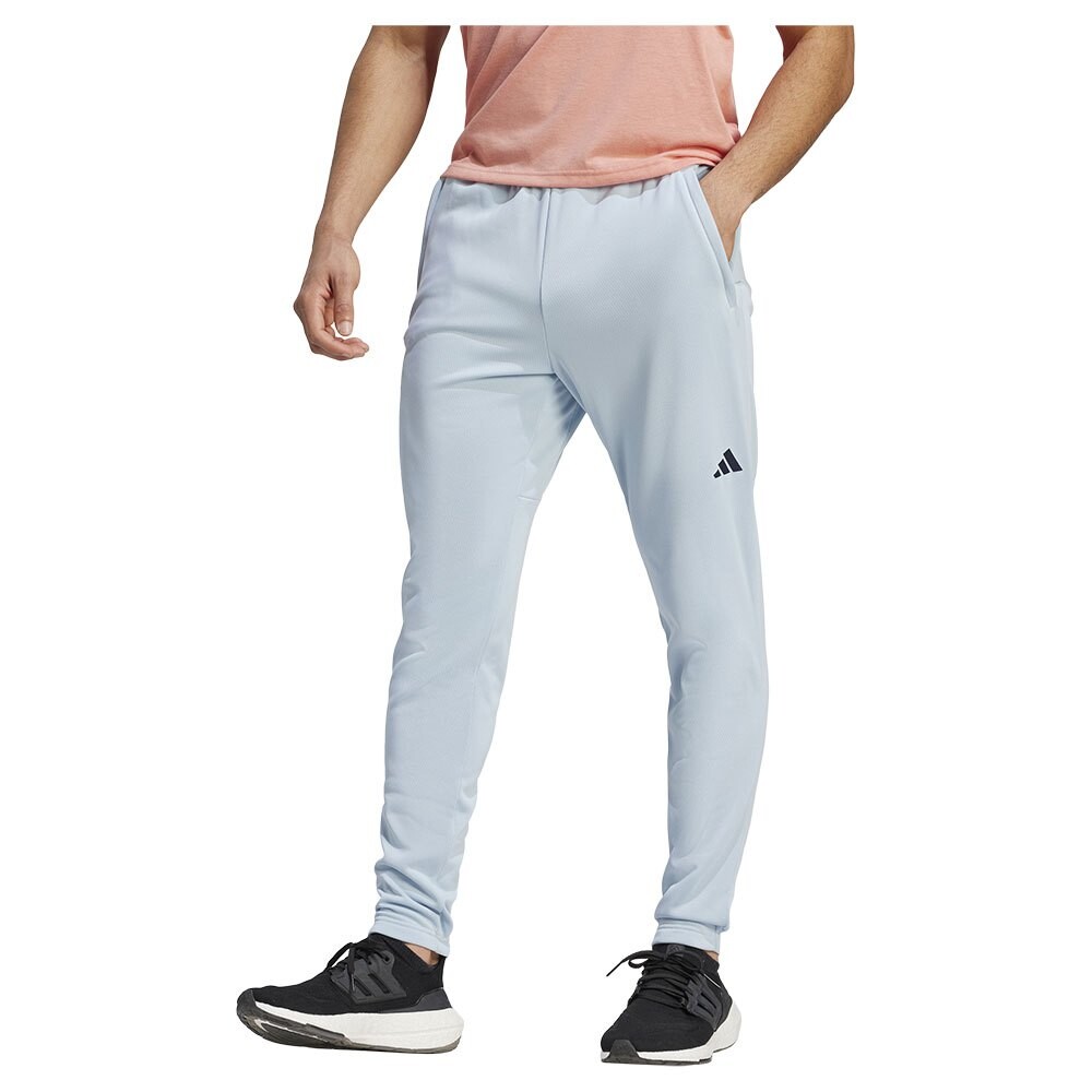 

Брюки adidas Essentials Seasonal Woven Joggers, синий