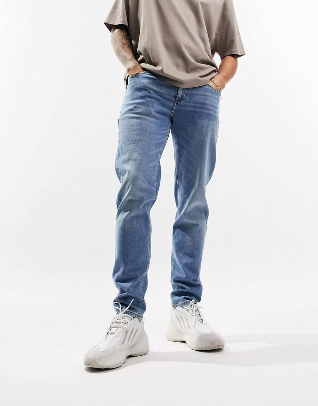 

Светло-голубые винтажные зауженные джинсы ASOS DESIGN