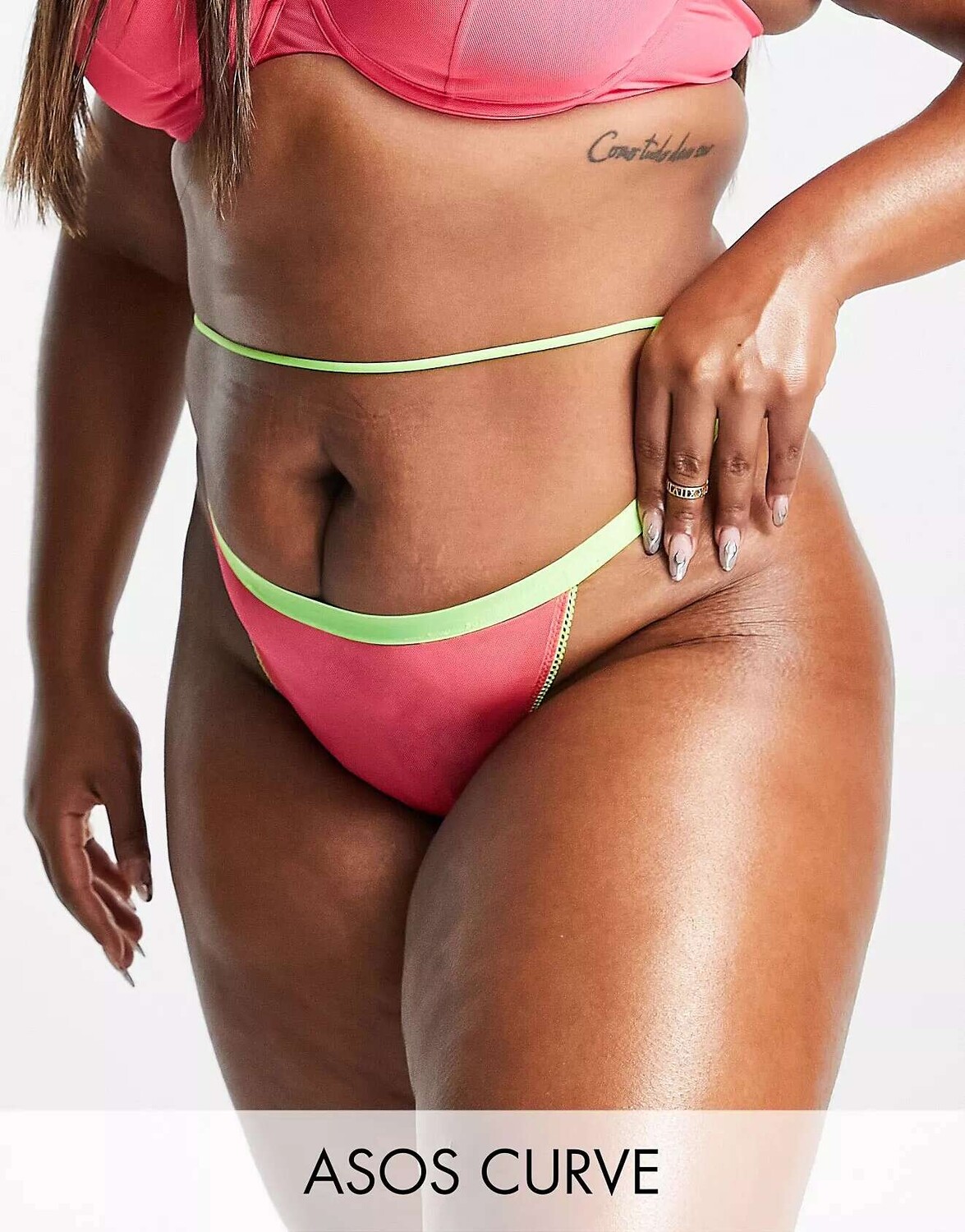 

Розовые стринги из контрастной неоновой сетки ASOS DESIGN Curve Madison