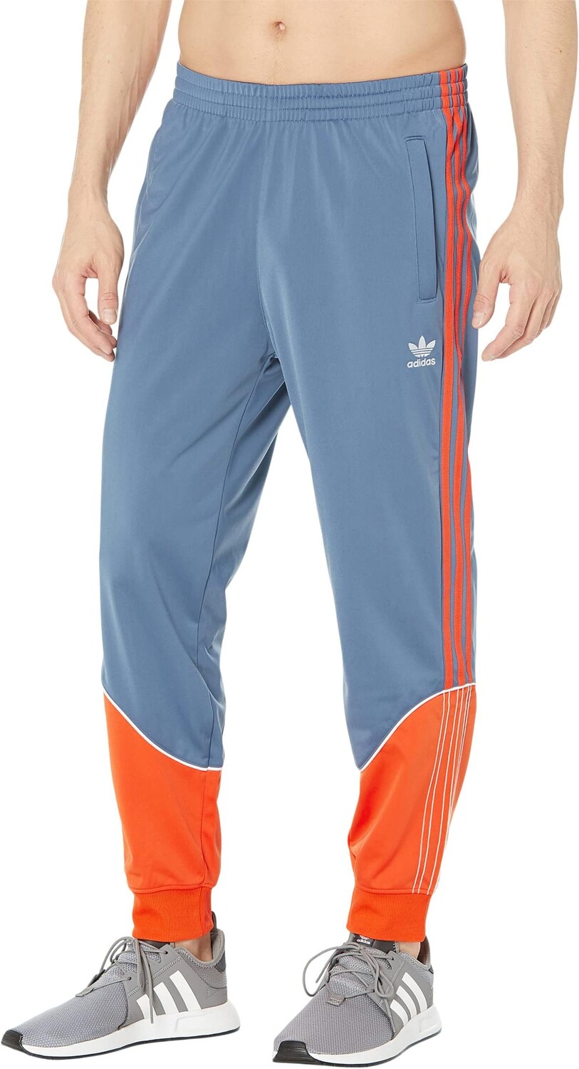 

Спортивные брюки из трикотажа Superstar adidas, цвет Wonder Steel/Semi Impact Orange/White