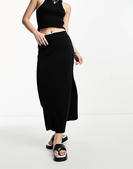 

Черная трикотажная юбка миди в рубчик ASOS DESIGN
