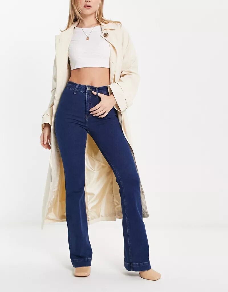 

Синие расклешенные джинсы без карманов со средней посадкой River Island