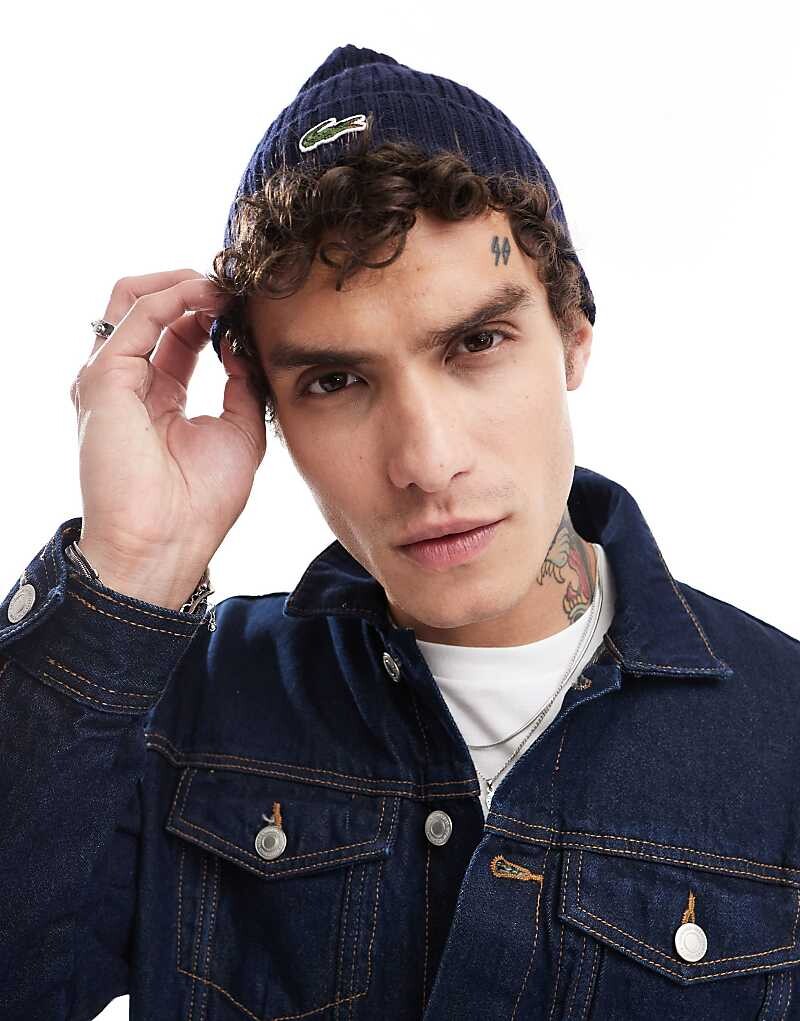 

Темно-синяя вязаная шапка с логотипом Lacoste