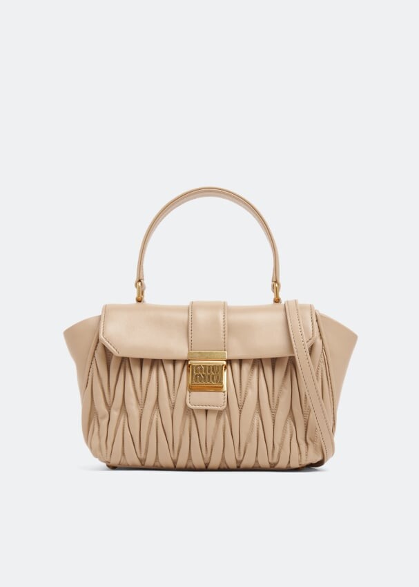 

Сумка Miu Miu Matelassé Top Handle, бежевый