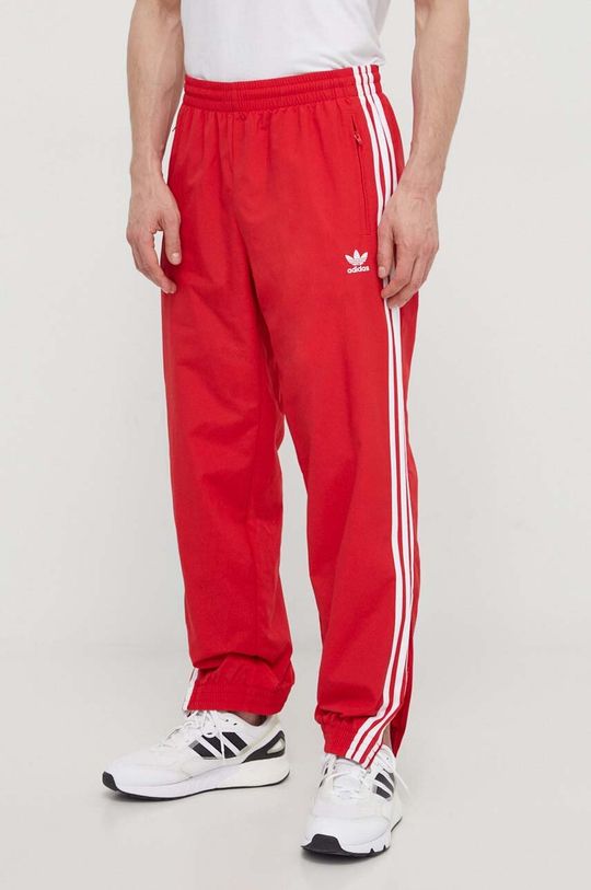 цена Спортивные брюки из тканого материала Adicolor Firebird Track Top adidas Originals, красный
