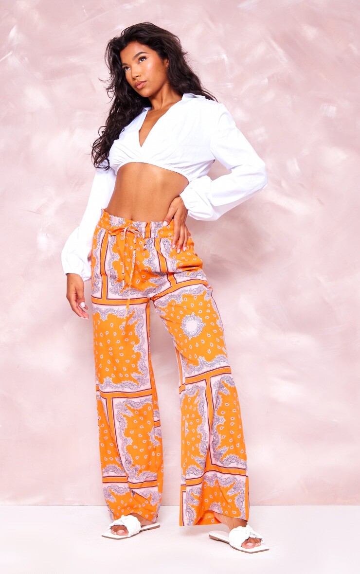 

PrettyLittleThing Оранжевые широкие брюки с широкими штанинами и завязками на талии с ацтекским принтом, Оранжевый