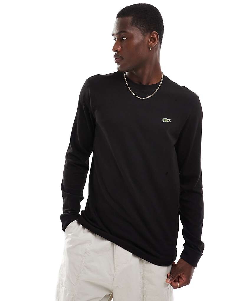 

Lacoste – черная футболка с длинными рукавами и логотипом