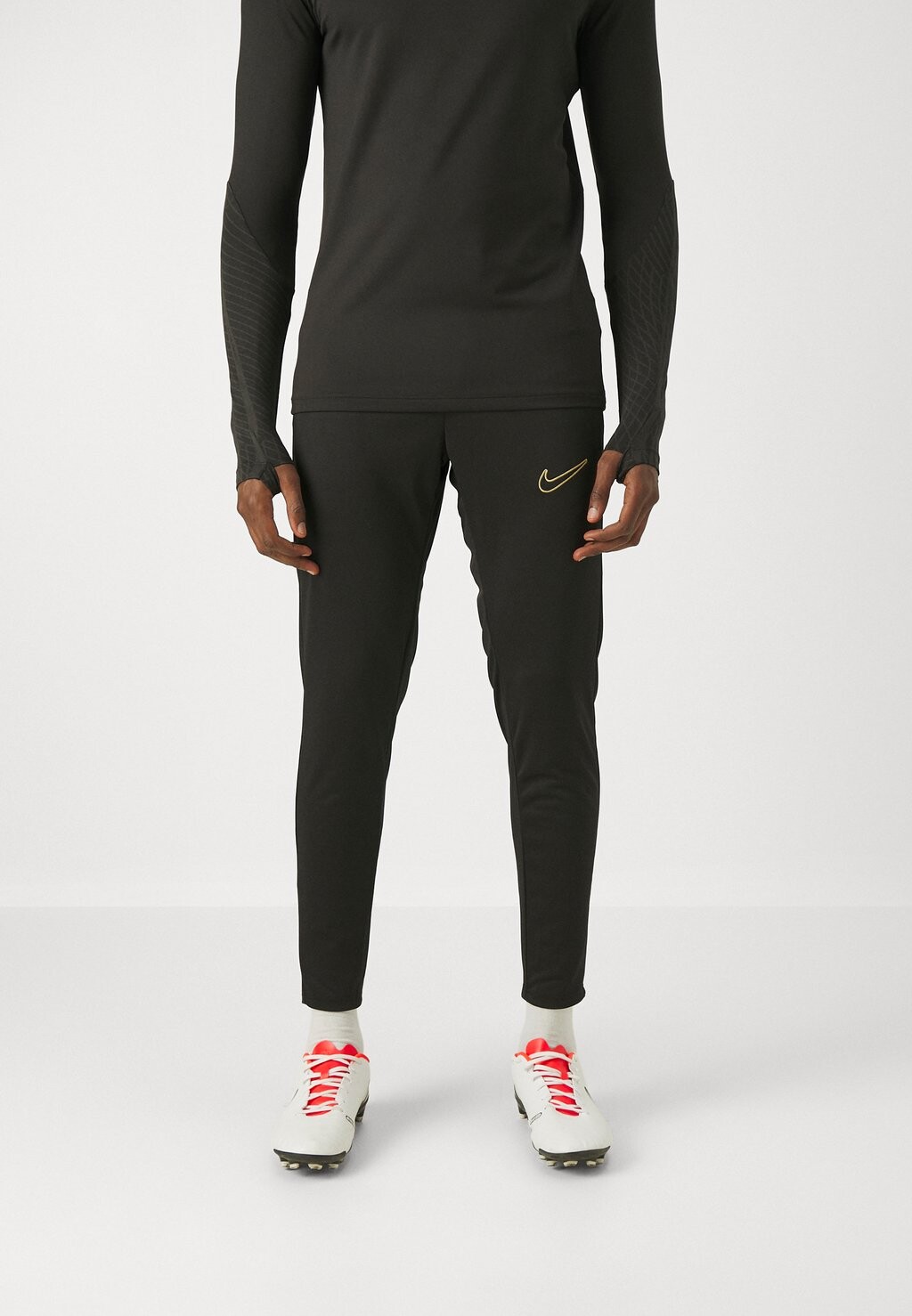 

Спортивные брюки Academy 23 Pant Nike, цвет black/metallic gold