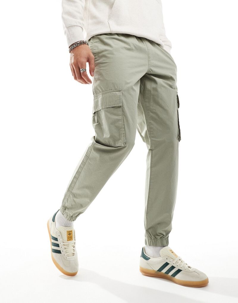 

Зеленые зауженные брюки ASOS DESIGN