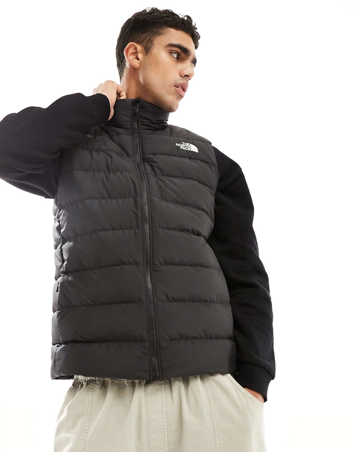

Черный пуховый жилет The North Face Aconcagua 3