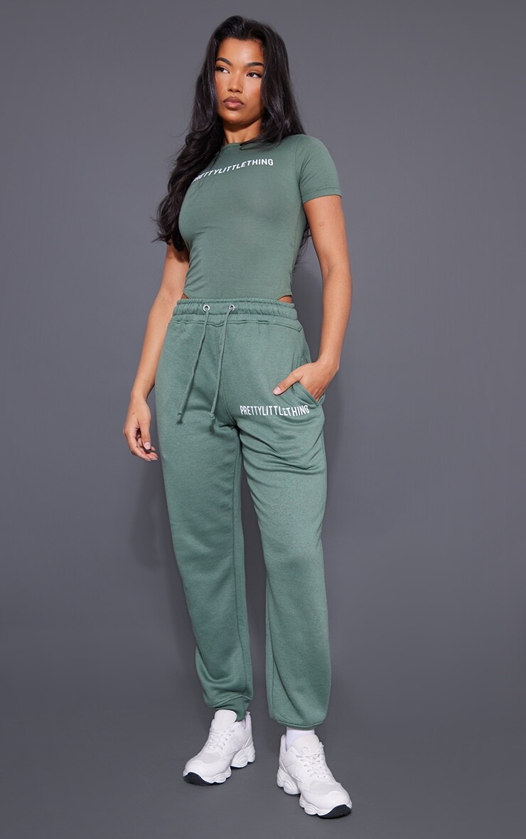 

PrettyLittleThing Море-зеленые джоггеры с манжетами и высокой талией с логотипом