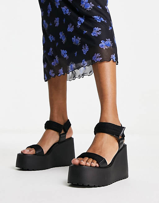 

Черные спортивные туфли на массивной танкетке ASOS DESIGN Trina, Черный