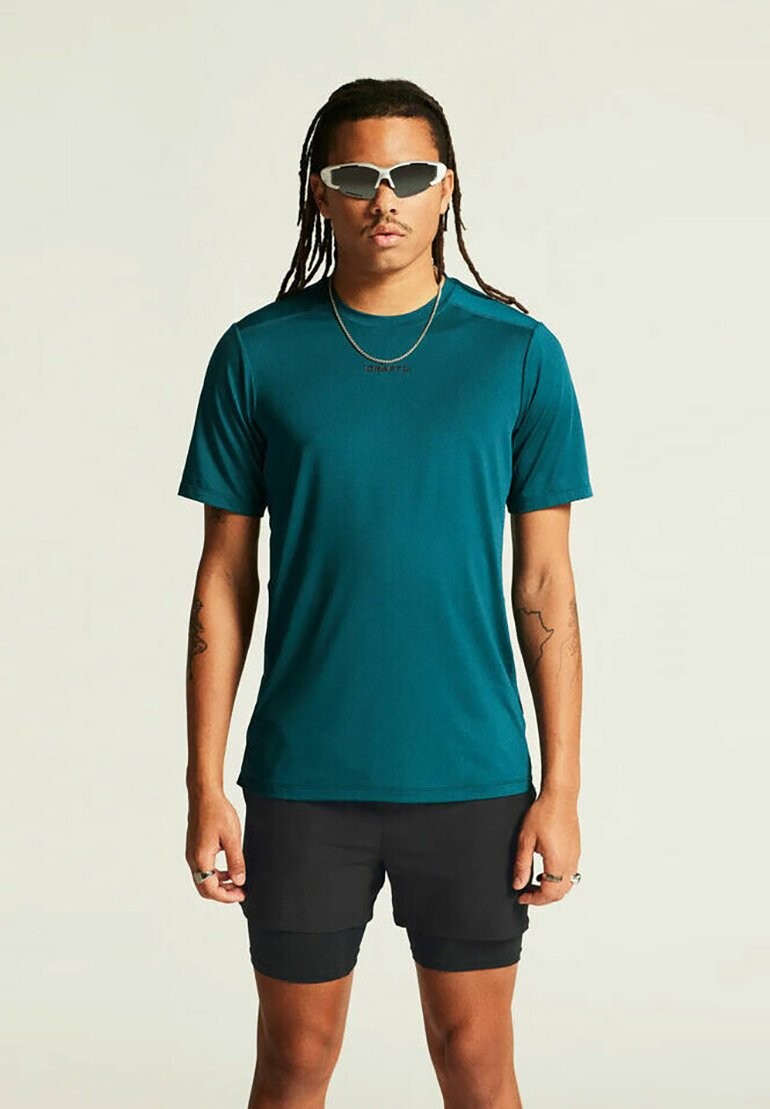 

Футболка с принтом LAUF ADV ESSENCE SHORTSLEEVE Craft, бирюзовый