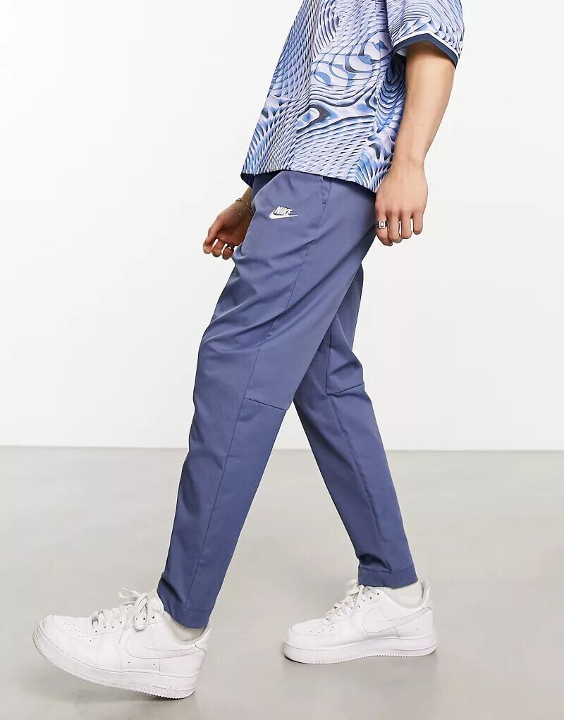 

Синие тканые зауженные брюки Nike Club
