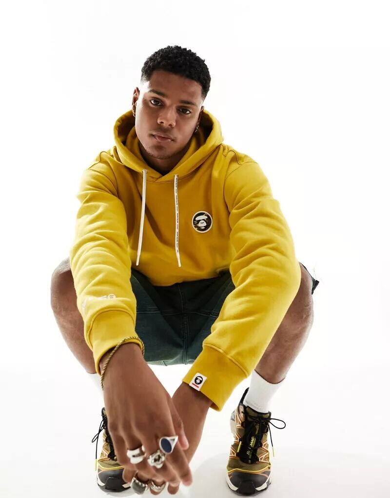 

Желтая толстовка с принтом Now Aape By A Bathing Ape