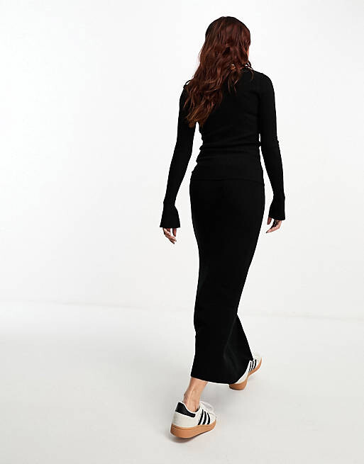 

Черная трикотажная юбка миди в рубчик ASOS DESIGN