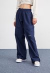 Брюки с боковыми карманами Nike, темно-синий женские широкие брюки с боковыми карманами yerse темно синий