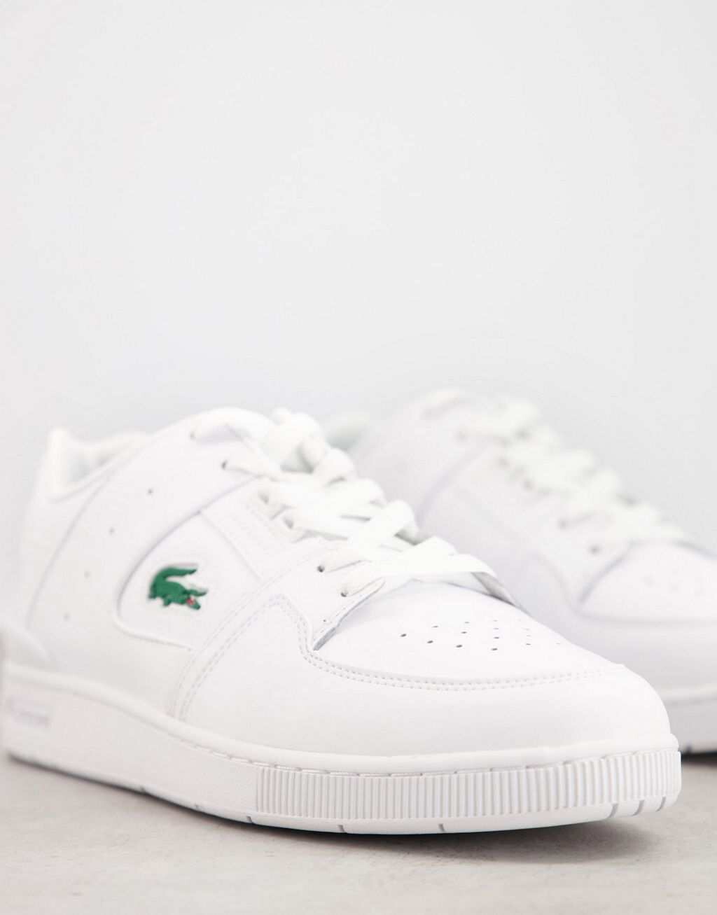 

Белые кроссовки-клетка Lacoste