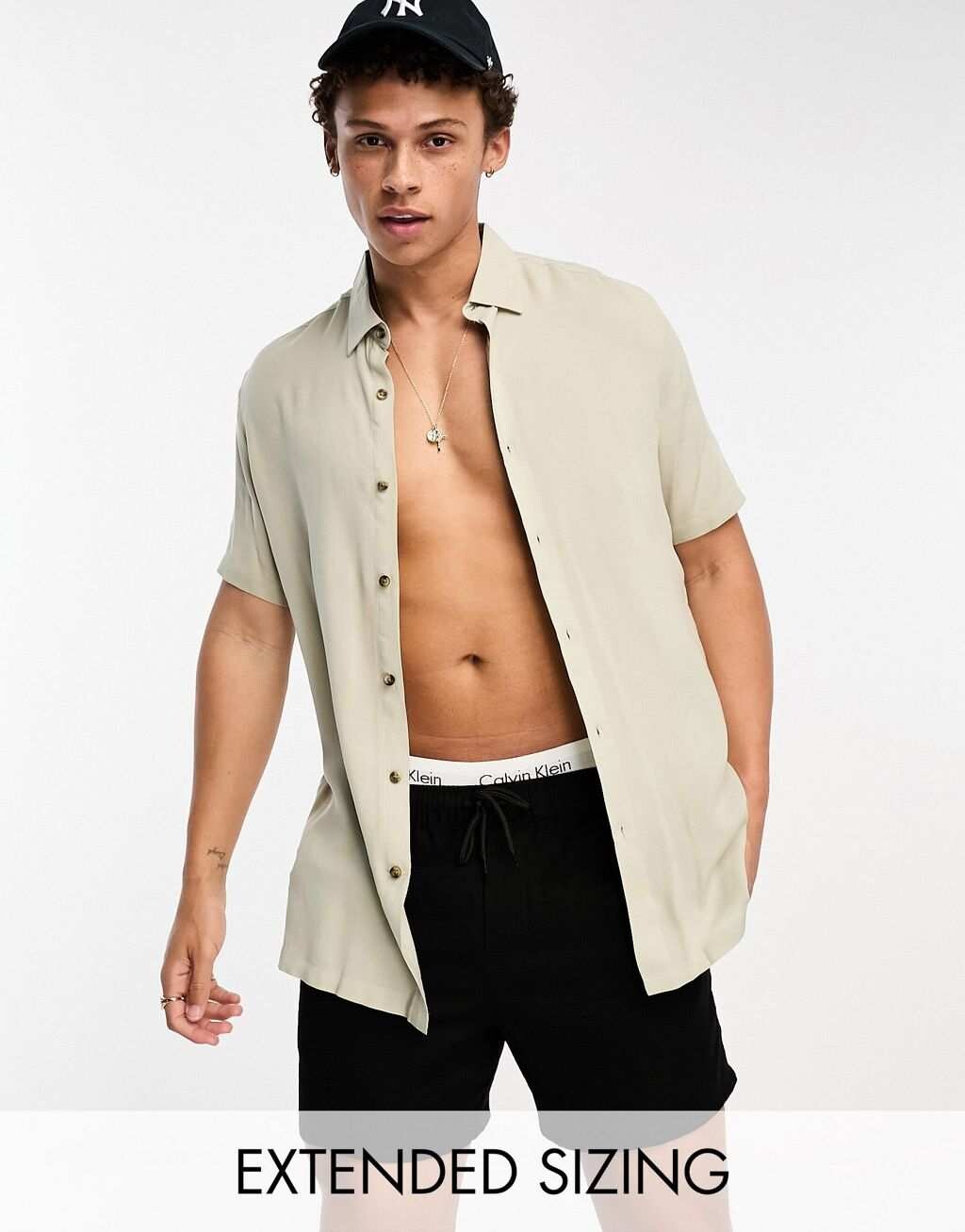 

Оливково-зеленая рубашка из вискозы стандартного кроя ASOS DESIGN