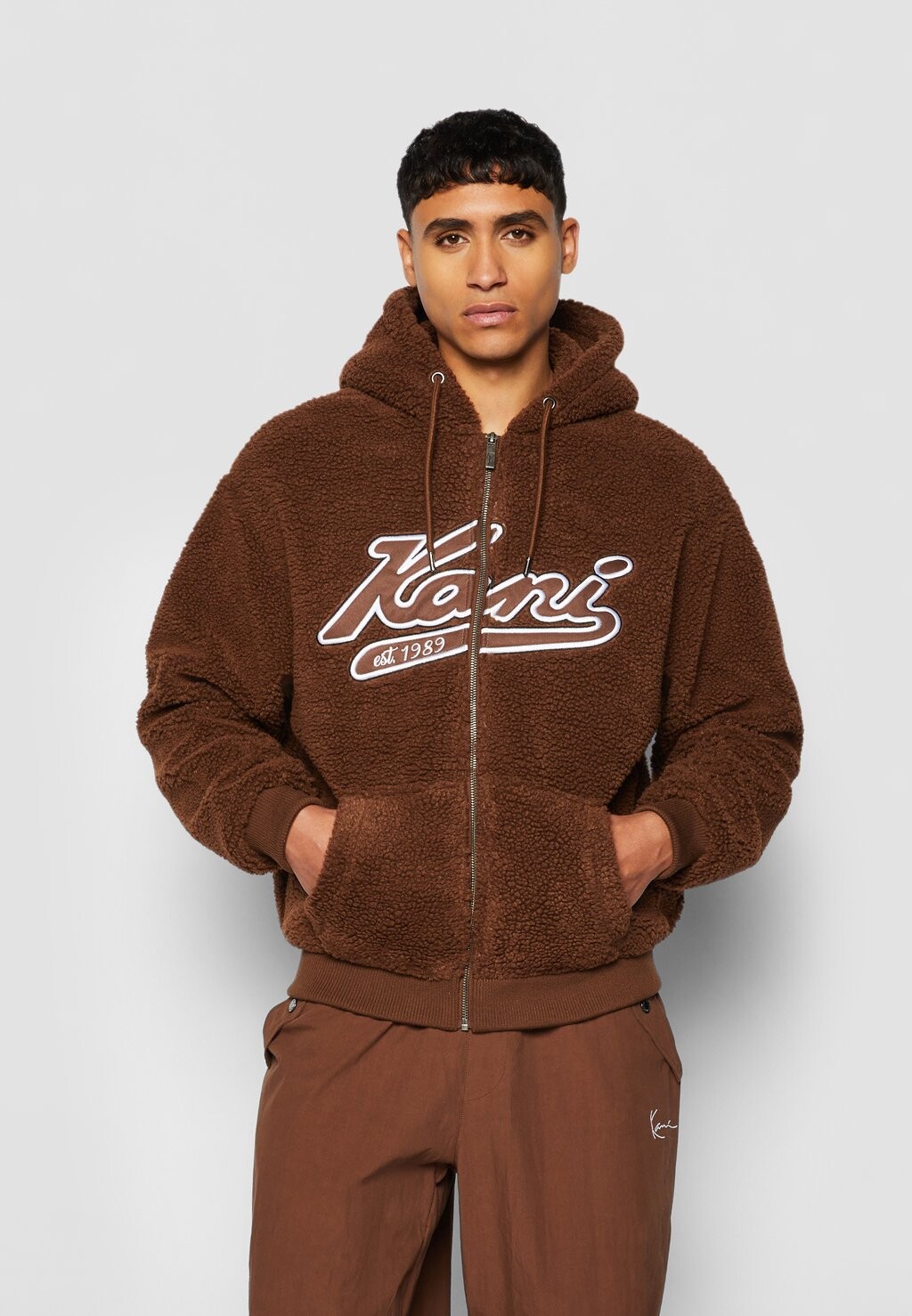 

Толстовка Karl Kani KM VARSITY TEDDY FULL ZIP, коричневый