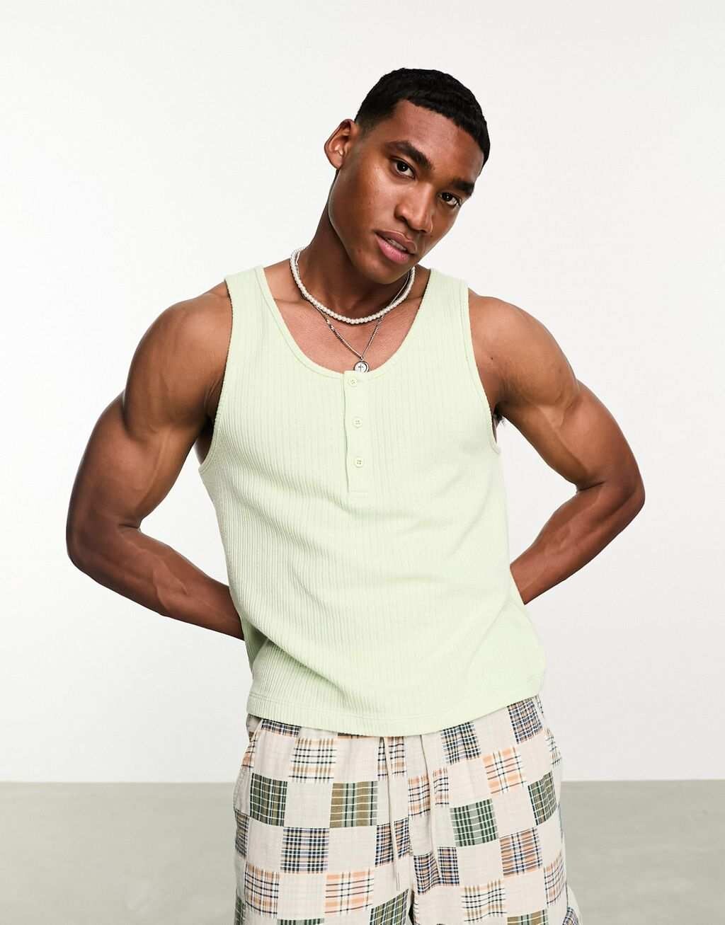 

Зеленый жилет с овальными ребрами и пуговицами ASOS DESIGN