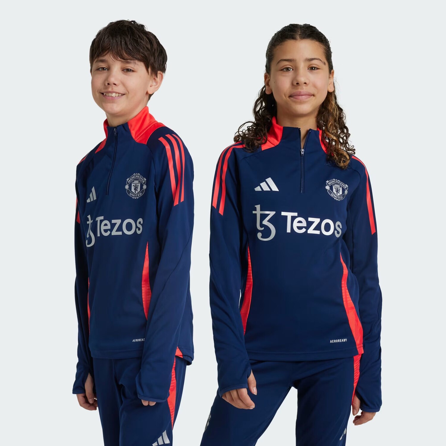 

Манчестер Юнайтед Тиро 24 Тренировочная куртка Adidas, цвет Night Indigo/Bright Red