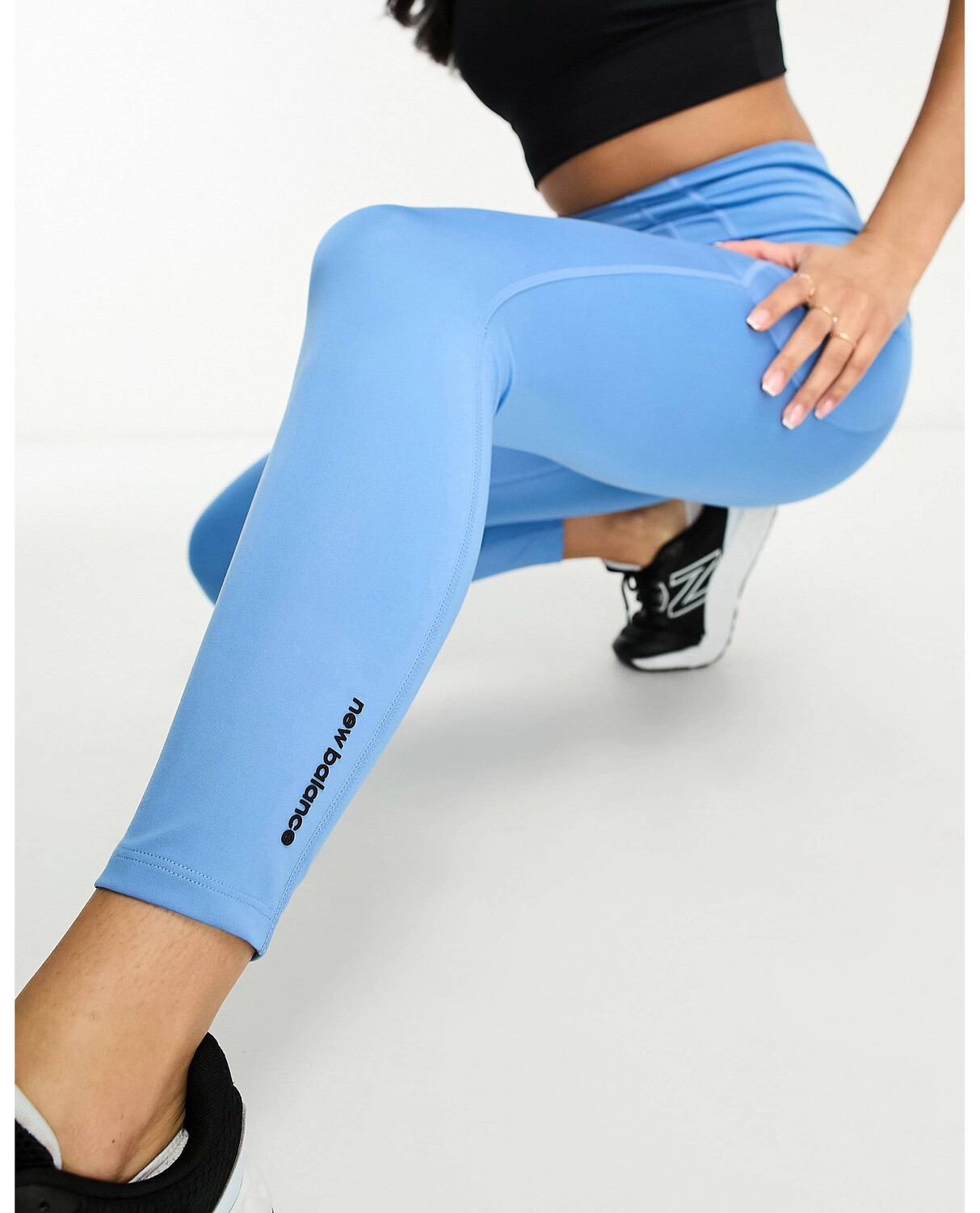 

Синие тайтсы с высокой посадкой и карманами New Balance Shape Shield 7/8, Синий