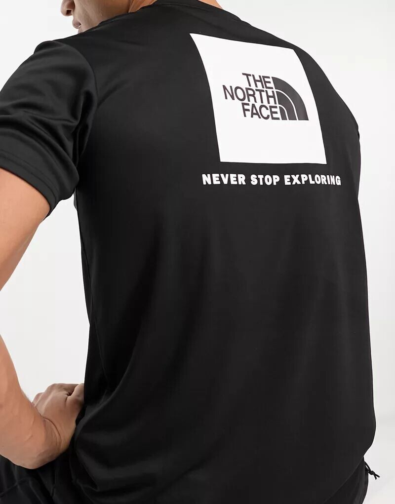 

Черная футболка с принтом на спине The North Face Training Reaxion Redbox