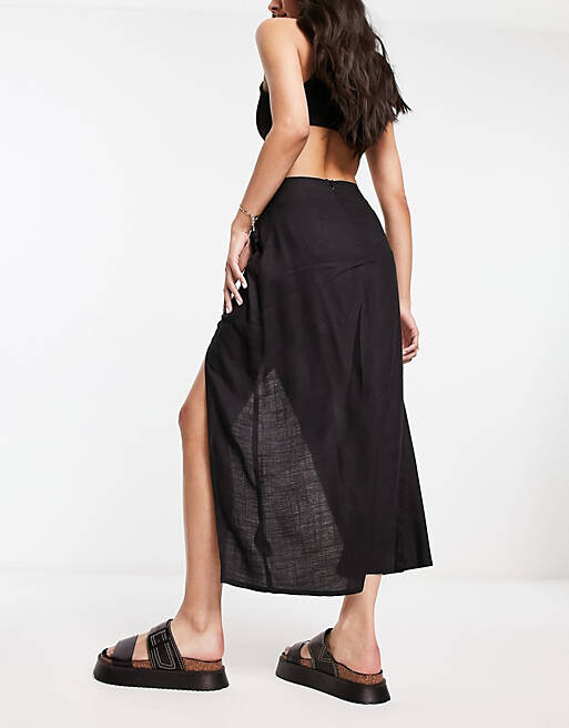 

Черная юбка миди со сборками по бокам ASOS DESIGN