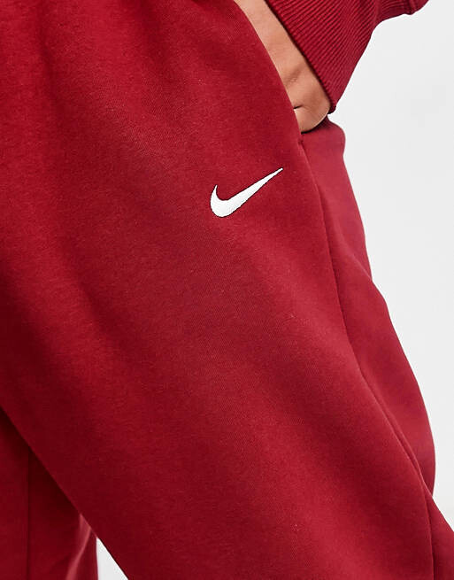 

Красные джоггеры Nike Plus Phoenix