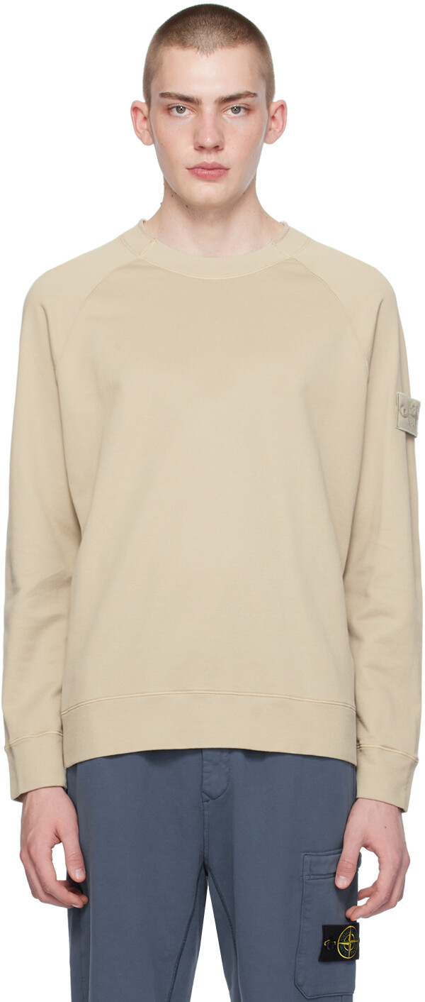 

Бежевый свитшот с нашивками Stone Island