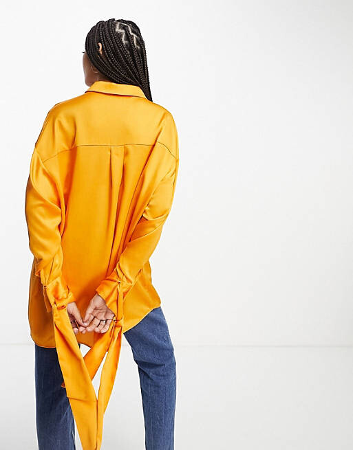 

Абрикосово-оранжевая рубашка оверсайз с манжетами на завязках ASOS DESIGN