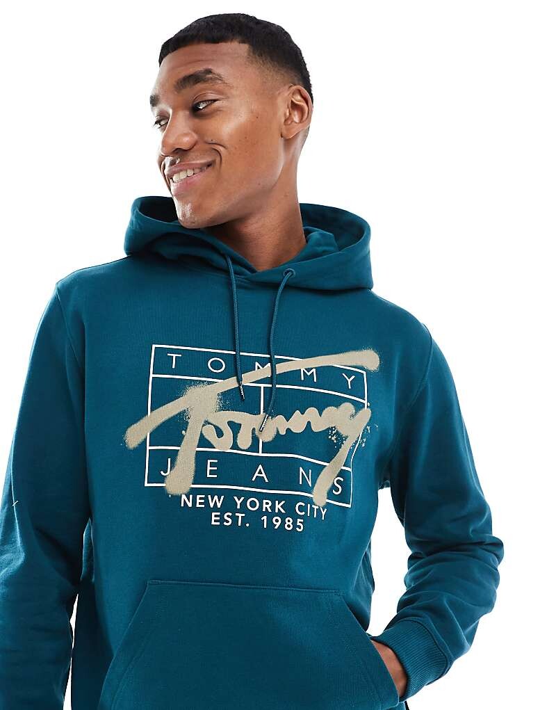 

Зелено-синяя худи Tommy Jeans с фирменным логотипом в стиле граффити