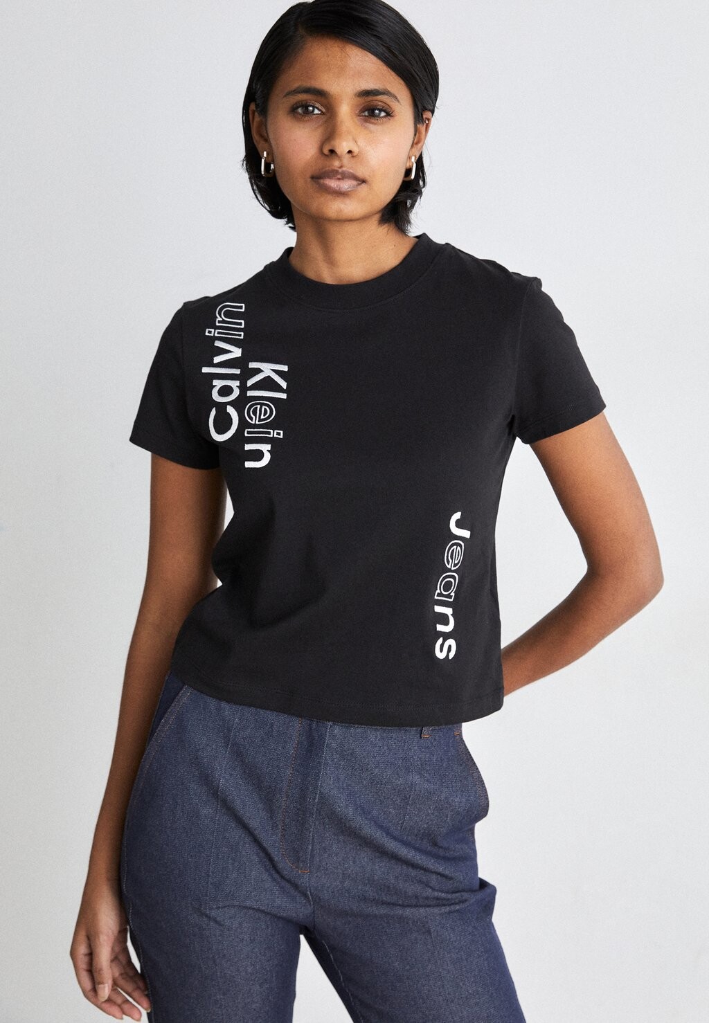 

Футболка с принтом Multi Placement Logo Tee Calvin Klein Jeans, черный