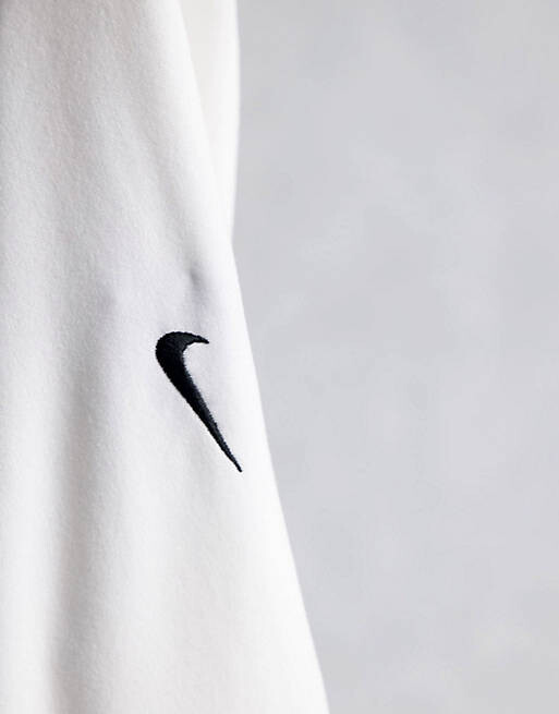 

Белый топ с длинными рукавами и воротником-стойкой Nike Essential