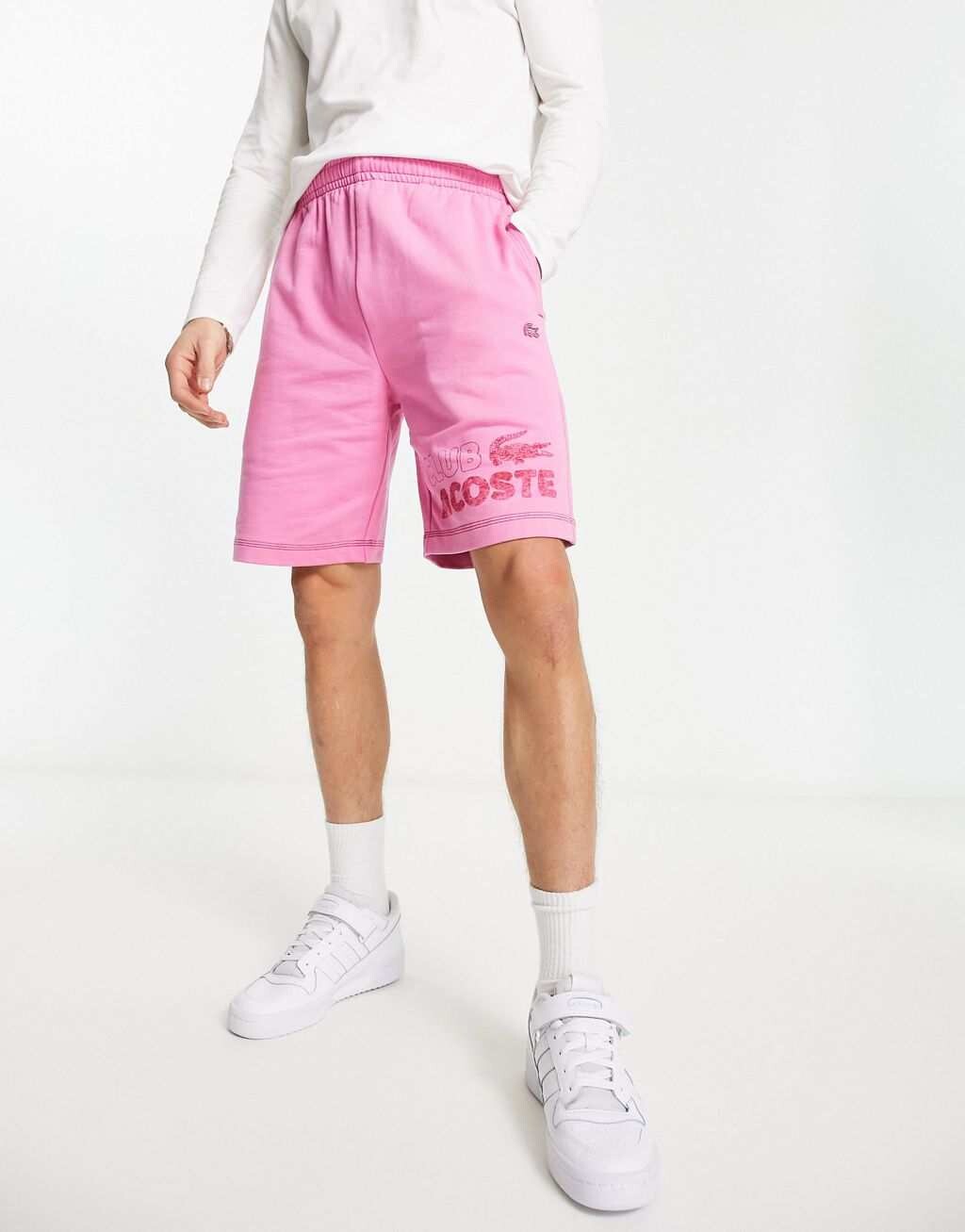 

Розовые трикотажные клубные шорты Lacoste