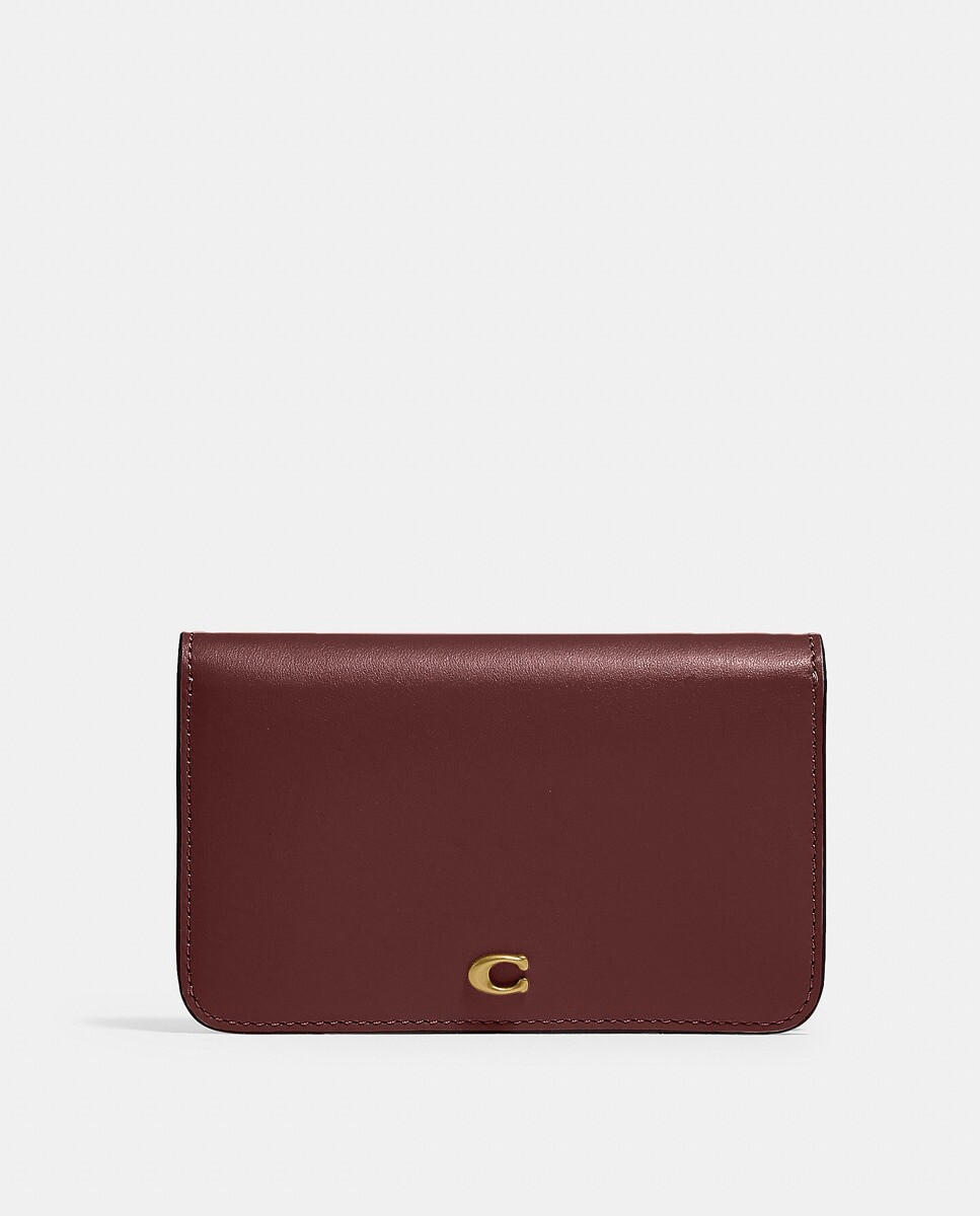 

Визитница из яловой кожи бордового цвета с металлическим логотипом Coach, бордо