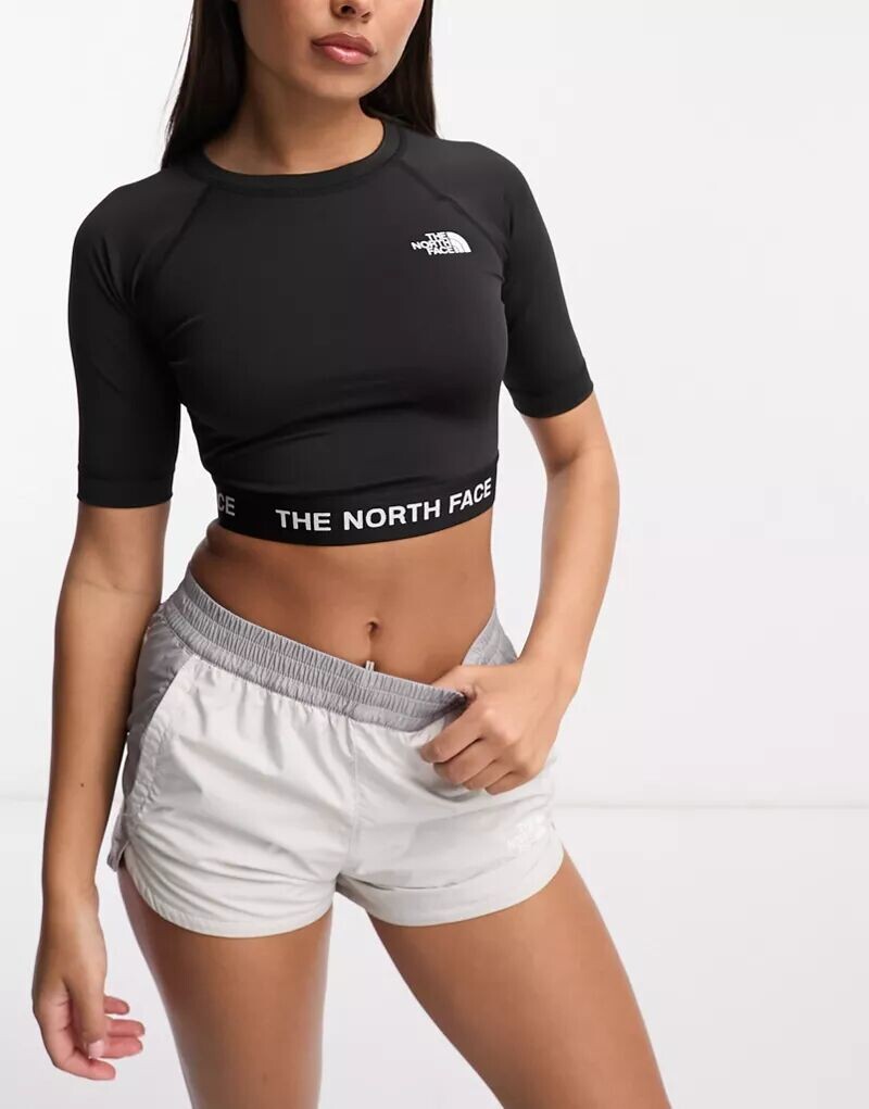 

Черный укороченный топ с длинными рукавами The North Face Training