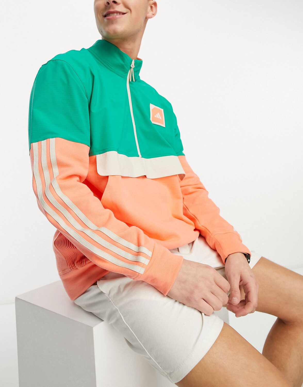 

Зелено-оранжевый анорак adidas Golf Adicross с короткими молниями