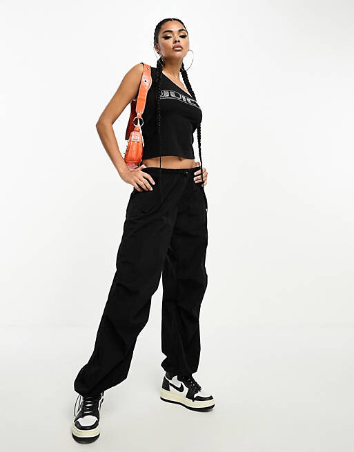 

Черный топ на одно плечо с логотипом из бриллиантов Juicy Couture