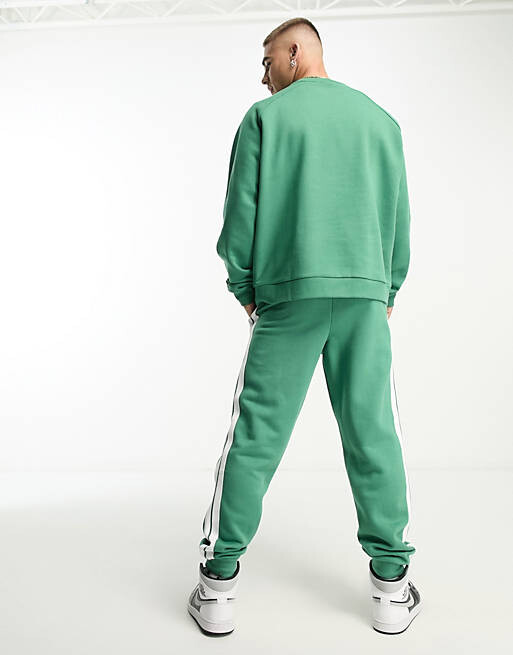 

Зеленый свитшот унисекс Community Club Ellesse