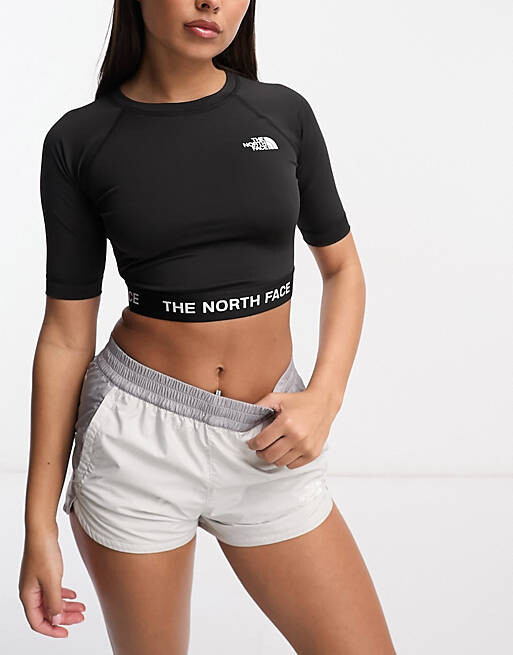 

Черный укороченный топ с длинными рукавами The North Face Training
