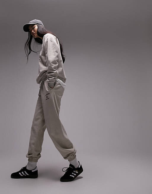 

Большие джоггеры с манжетами и винтажным принтом Topshop Co-ord Los Angeles