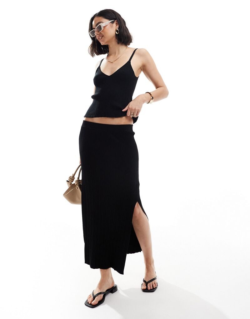 

Черная трикотажная юбка миди ASOS DESIGN