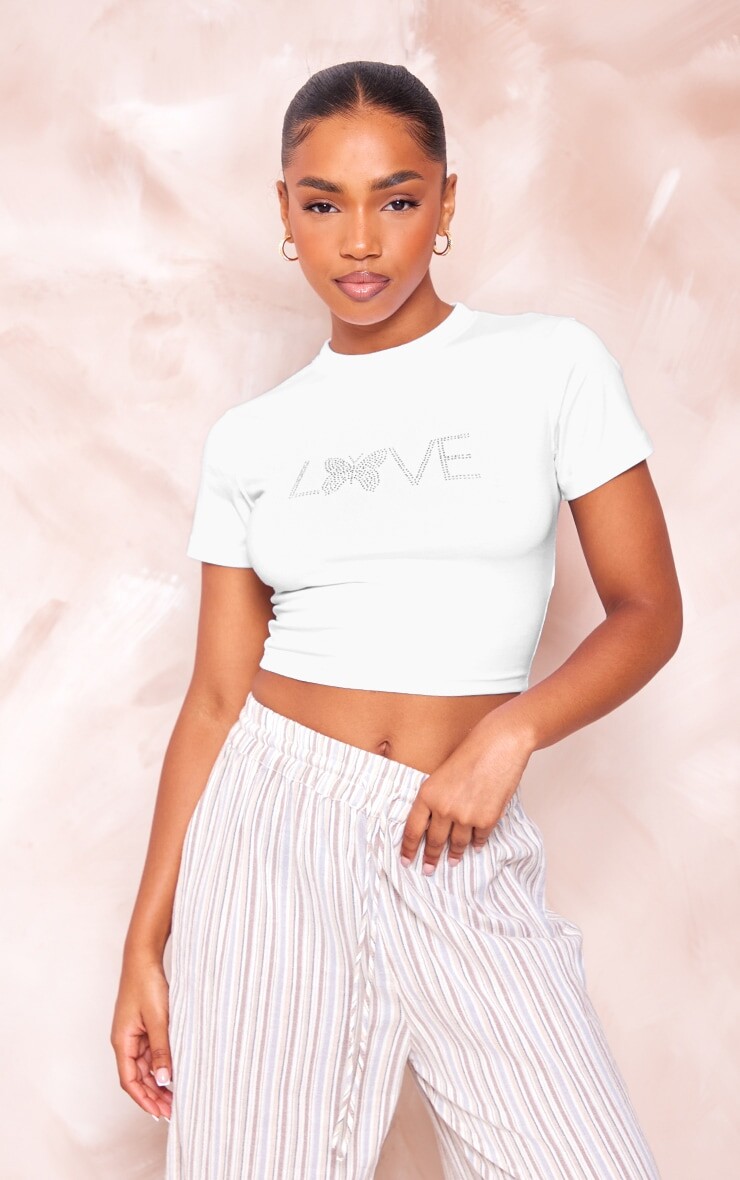 

PrettyLittleThing Белая хлопковая укороченная футболка с принтом Love