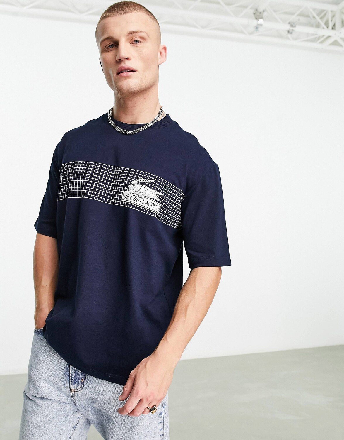 

Темно-синяя футболка свободного кроя Lacoste с графикой спереди, Синий