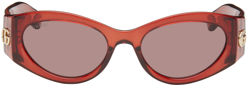 

Красные овальные солнцезащитные очки Gucci